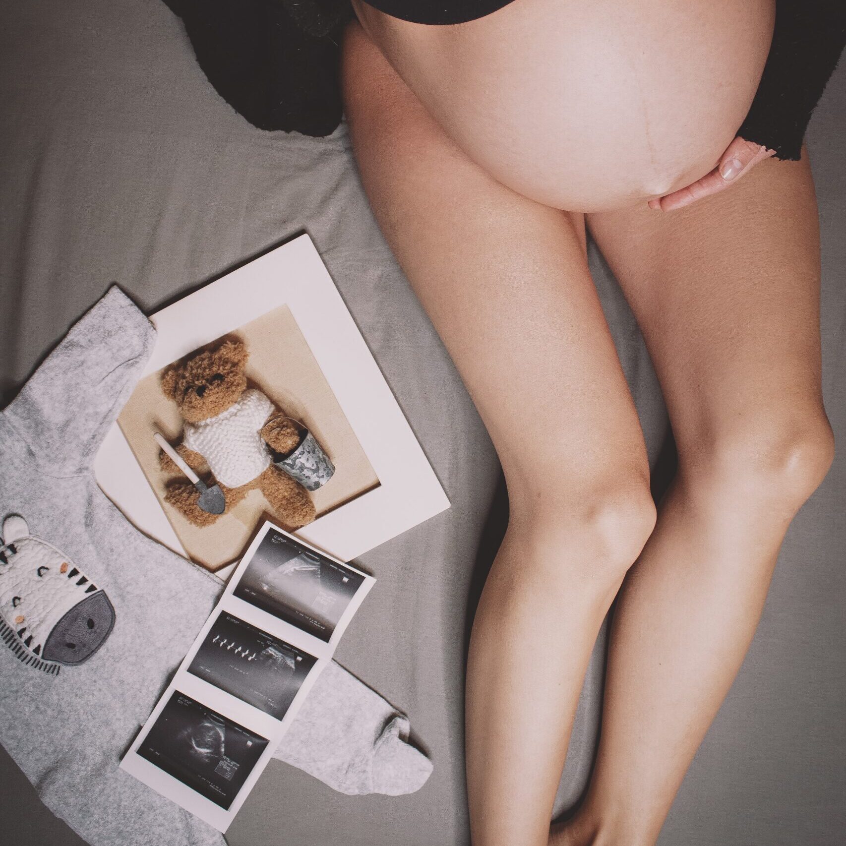 Pregnant woman with baby photos
